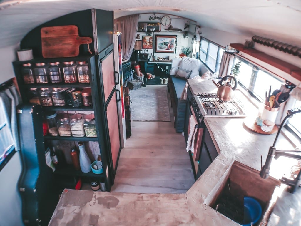 We get a lot of questions about our little skoolie kitchen! From our conrete countertops to the rose gold appliances, here are the answers! | Since We Woke Up | sincewewokeup.com