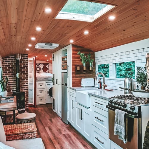 Today we're featuring the Going Boundless skoolie - a bus conversion with an open layout, tons of amenities, and a luxurious vibe. See it here! | www.sincewewokeup.com | Since We Woke Up